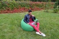 Handsome Arab Young Businessman Sits With Laptop in Chair, Looks Royalty Free Stock Photo