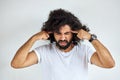 Handsome arabian man with beard is suffering from headache desperate and stressed Royalty Free Stock Photo