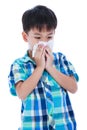 Handsome asian boy blowing his nose into tissueon. Isolated on w Royalty Free Stock Photo