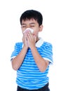 Handsome asian boy blowing his nose into tissueon. Isolated on w Royalty Free Stock Photo