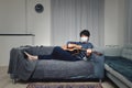 Handsome Asian boy playing guitar at home Royalty Free Stock Photo