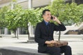 Handsome asian businessman talking on his cell phone Royalty Free Stock Photo