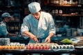 Handsome Asian chef cooking in kitchen Royalty Free Stock Photo