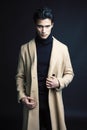 Handsome asian fashion looking man posing in studio on black background, lifestyle modern people concept close up