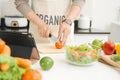 Handsome asian man chopping vegetables in the kitchen Royalty Free Stock Photo