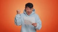 Asian man open envelope letter, great news, celebrate, monetary award, invitation, bank loan approve