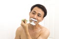Handsome asian man trying shave beard Royalty Free Stock Photo