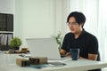 Handsome asian man working with interior design project at creative office Royalty Free Stock Photo