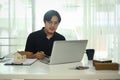 Handsome asian man working with interior design project at creative office Royalty Free Stock Photo