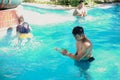 Handsome asian men having fun at swimming pool under sunlight Royalty Free Stock Photo