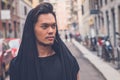 Handsome Asian model posing in the city streets Royalty Free Stock Photo