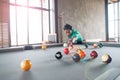 Handsome asian young man playing pool at home, Selective focus Royalty Free Stock Photo