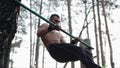 Handsome athlete does an upside-down on the horizontal bar. callisthenics. Guy doing exercises