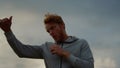 Athlete fighting with shadow. Male sports man warming arms before workout