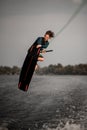handsome athletic man doing an extreme jump on wakeboard Royalty Free Stock Photo