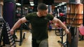 Handsome athletic man doing pectorals on the crossover trainer in the gym. Shot in 4k