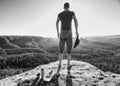 Handsome man took rest for snack. Tourist stay on summit rock Royalty Free Stock Photo