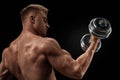 Handsome athletic man working out with dumbbells Royalty Free Stock Photo