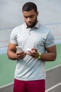 Handsome athletic young man with a fitbit tracker Royalty Free Stock Photo