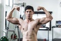 Handsome Attractive Asian men doing bodybuilder Front Double Biceps pose in gym Royalty Free Stock Photo