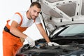 handsome auto mechanic auto mechanic repairing car with wrench