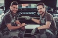 Handsome auto service workers Royalty Free Stock Photo