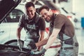 Handsome auto service workers Royalty Free Stock Photo