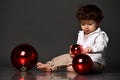 Handsome baby boy with Christmas tree toy ball portrait Royalty Free Stock Photo