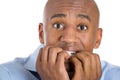 Handsome bald man scared and afraid with fingers in mouth Royalty Free Stock Photo