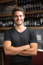 Handsome bar tender standing behind his counter Royalty Free Stock Photo