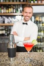 Handsome bar tender standing behind his counter Royalty Free Stock Photo