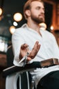 Handsome barber is in the salon