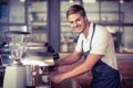 Handsome barista making a cup of coffee Royalty Free Stock Photo
