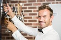 Handsome barman pouring a pint of beer Royalty Free Stock Photo
