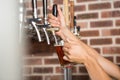Handsome barman pouring a pint of beer Royalty Free Stock Photo