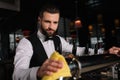 handsome bartender cleaning beer taps Royalty Free Stock Photo