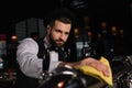 handsome bartender cleaning beer taps Royalty Free Stock Photo