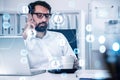 Handsome beard businessman in glasses wearing formal shirt and talking smartphone to check social network to hire new candidate. Royalty Free Stock Photo