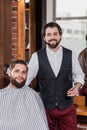 handsome bearded barber with client Royalty Free Stock Photo