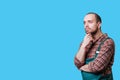 handsome bearded Dressed in a studio setting against a blue background