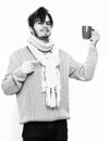 Handsome bearded man with cup in sweater and scarf Royalty Free Stock Photo