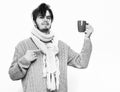 Handsome bearded man with cup in sweater and scarf Royalty Free Stock Photo