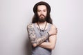 Handsome bearded man in hat.tattoo.hipster Royalty Free Stock Photo