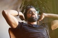 Handsome bearded man in headphones listening to music at home. Relaxing and rest time concept. Blurred background Royalty Free Stock Photo