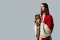 Bearded man holding holy bible isolated on grey Royalty Free Stock Photo