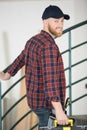 handsome bearded man holding toolbox