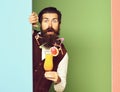 Surprised handsome bearded man on colorful studio background Royalty Free Stock Photo