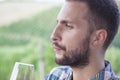 Handsome bearded man looking glass of wine Royalty Free Stock Photo