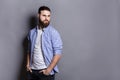 Handsome bearded man posing with hands in pocket Royalty Free Stock Photo