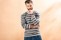 Handsome bearded man posing in striped sweatshirt Royalty Free Stock Photo